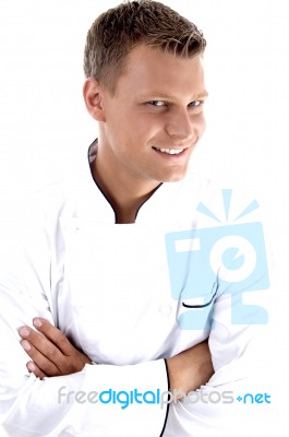 Young Chef Posing With His Arms Crossed Stock Photo