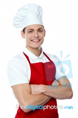 Young Chef With Crossed Arms Stock Photo