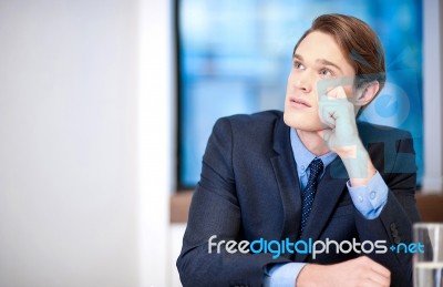 Young Classy Businessman Thinking Stock Photo