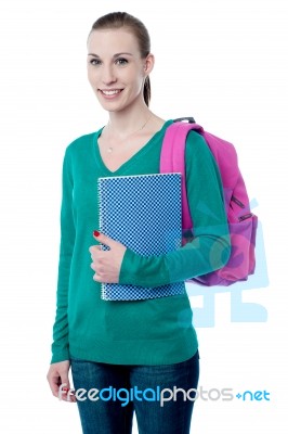 Young College Girl With Backpack And Notebook Stock Photo