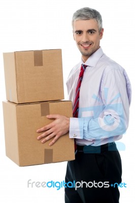 Young Corporate Man Holding Card Box Stock Photo