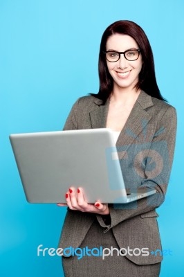 Young Corporate Woman Working On Laptop Stock Photo