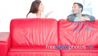 Young Couple Blowing Kisses At Each Other Stock Photo