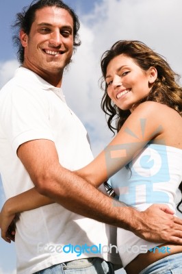 Young Couple Cuddling Stock Photo