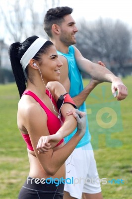 Young Couple Doing Stretching Stock Photo