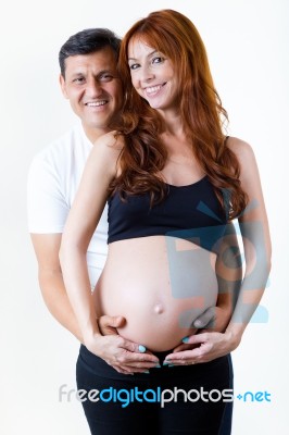 Young Couple Expecting Baby. Isolated On White Stock Photo