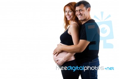 Young Couple Expecting Baby. Isolated On White Stock Photo