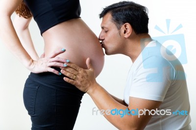 Young Couple Expecting Baby. Isolated On White Stock Photo