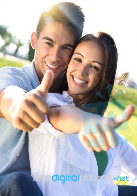 Young Couple Having Fun In A Park Stock Photo