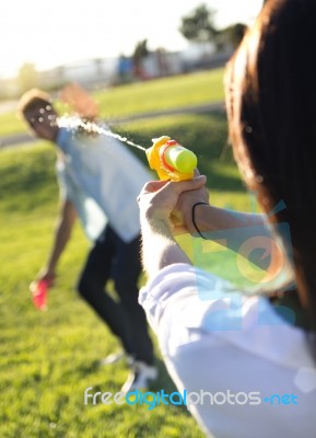 Young Couple Having Fun In A Park Stock Photo