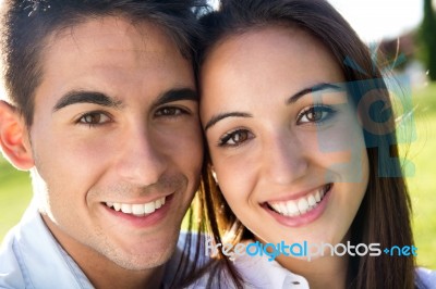 Young Couple Having Fun In A Park Stock Photo