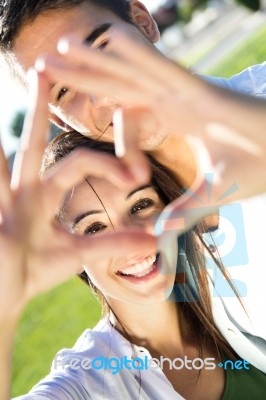 Young Couple Having Fun In A Park Stock Photo