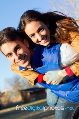 Young Couple Having Fun In The Park Stock Photo