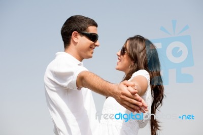 Young Couple Holding Hands Stock Photo