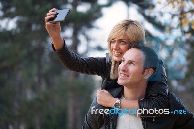 Young Couple In Park Stock Photo