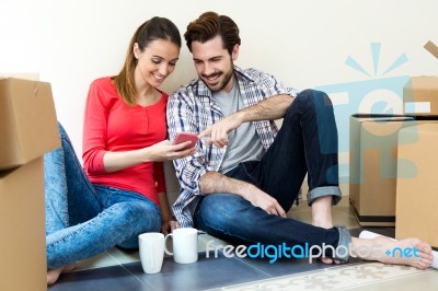 Young Couple Moving In New Home Stock Photo