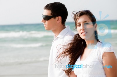 Young Couple On The Beach Stock Photo