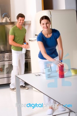 Young Couple Preparing Breakfast Stock Photo