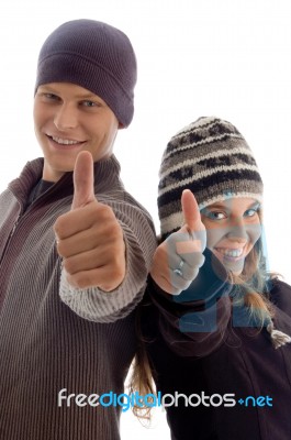 Young Couple Showing Thumbs Up Stock Photo