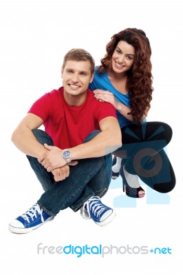 Young Couple Sitting On Floor Stock Photo