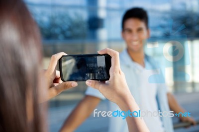 Young Couple Taking Photos With Mobile Stock Photo