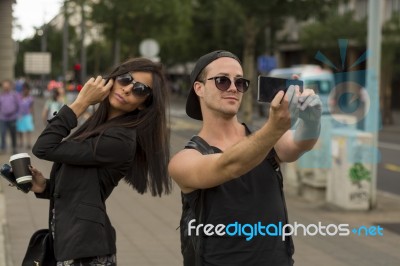 Young Couple Taking Selfies Stock Photo