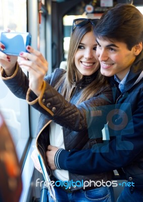 Young Couple Taking Selfies With Smartphone At Bus Stock Photo