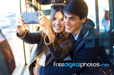 Young Couple Taking Selfies With Smartphone At Bus Stock Photo