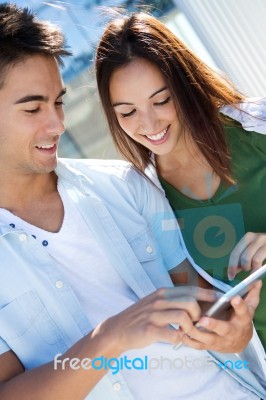 Young Couple Using A Digital Tablet Stock Photo