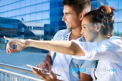 Young Couple Using A Digital Tablet Stock Photo