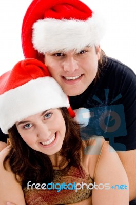 Young Couple Wearing Christmas Hat Stock Photo