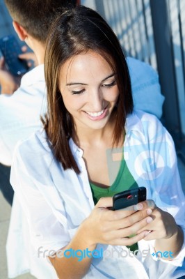 Young Couple With Smart Phone Stock Photo