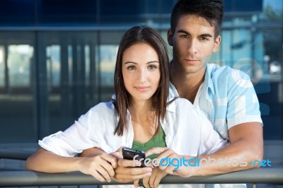 Young Couple With Smart Phone Stock Photo