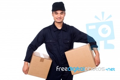 Young Courier Guy Holding Boxes Stock Photo