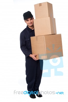 Young Courier Guy Moving Boxes Stock Photo