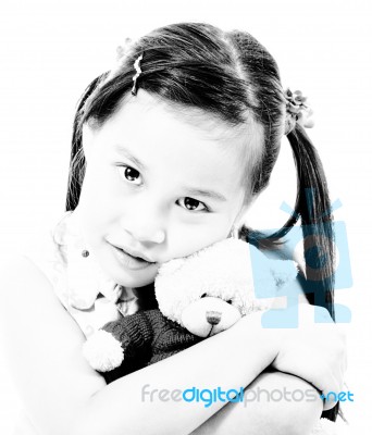 Young Cute Girl Hugging Her Teddy Bear Stock Photo