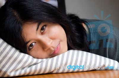 Young Cute Girl Resting On Soft Pillow Stock Photo