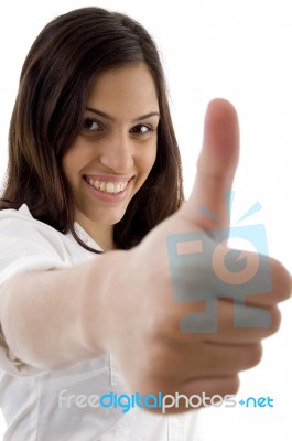 Young Cute Girl Showing Thumbs Up Stock Photo