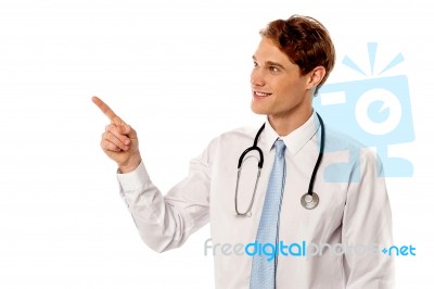 Young Doctor Pointing At Something Stock Photo