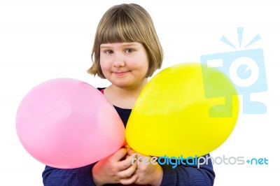 Young Dutch Girl Holding Two Balloons Stock Photo