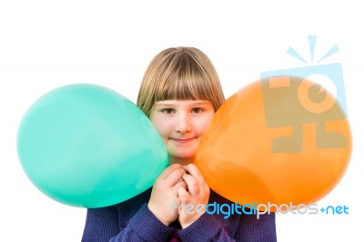 Young Dutch Girl Holding Two Colorful Balloons Stock Photo