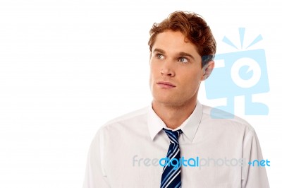 Young Employee In A Serious Thought Stock Photo