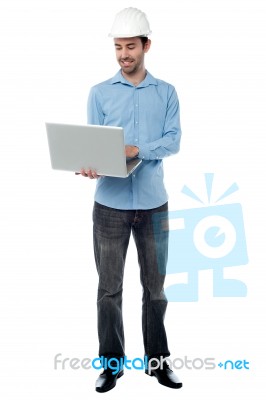 Young Engineer With Laptop Stock Photo