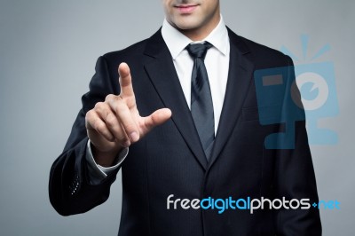 Young Executive Man Touching An Imaginary Screen Stock Photo