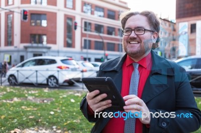 Young Executive Man With A Tablet Stock Photo