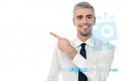 Young Executive Pointing At Something Stock Photo