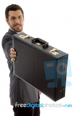 Young Executive Showing His Briefcase Stock Photo