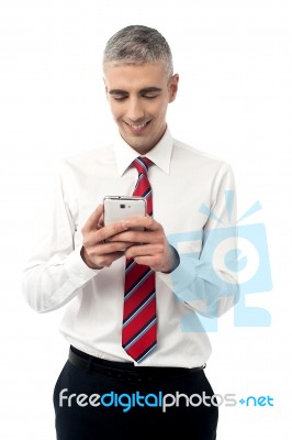 Young Executive Using Mobile Phone Stock Photo