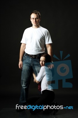 Young Family Posing Standing In Studio Stock Photo