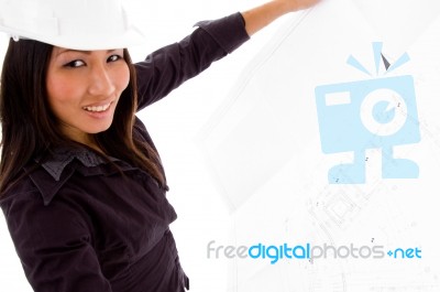 Young Female Engineer Searching Opened Blue Prints Stock Photo